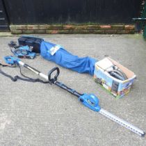 An electric hedge trimmer, together with an electric sander, a folding chair and a Wagner electric