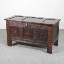 An 18th century oak and inlaid coffer, with a hinged lid 104w x 50d x 58h cm