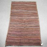 A Persian kilim rug, with striped design 270 x 160cm