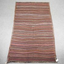 A Persian kilim rug, with striped design 270 x 160cm
