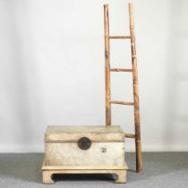 A Chinese leather trunk on stand, together with a bamboo ladder (2) 76w x 52d x 45h cm