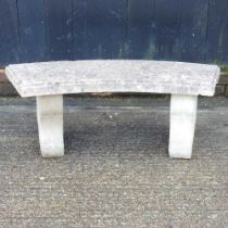 A curved cast stone garden bench, 107cm