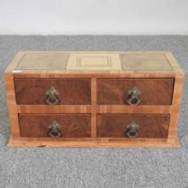 A miniature inlaid walnut chest, with four short drawers 46w x 19d x 22h cm