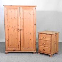 A modern pine double wardrobe, together with a pine bedside chest (2) 88w x 54d x 132h cm