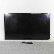 A Samsung 46 inch television, with remote control