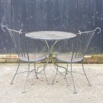 An iron garden table, together with two chairs (3) 78w x 73h cm