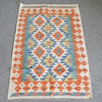 A kelim rug, with two rows of medallions and geometric design, 123 x 80cm