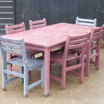 A painted hardwood garden table, with a set of six garden chairs (5) 180w x 90d x 75h cm