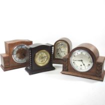 A 1920's oak cased mantel clock, 21cm high, together with three others (4)