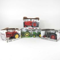 An Ertl 1/16 scale model Massey Harris 44 tractor, a Massey-Harris Challenger, a Super M-TA