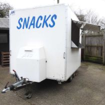An AJC catering trailer or burger van, with a hinged serving hatch and a twin axle 450w x 200d x