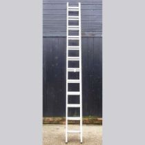 An aluminium extending ladder in two sections, each 330cm