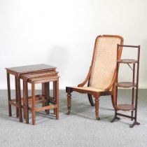 A 19th century cane seated chair, together with an early 20th century folding cakestand and a nest