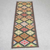 A kelim runner, with all over coloured diamond pattern, 191 x 64cm