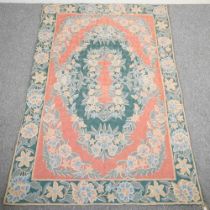 A wool chain rug, with floral decoration, 170 x 113cm