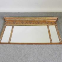 A Regency style gilt framed over mantel mirror, 20th century, with classical decoration, 81 x 132cm
