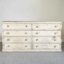 An early 20th century cream painted pine dresser base, containing two rows of four drawers 182w x
