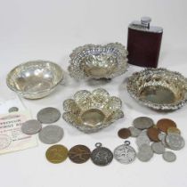 An early 20th century pierced silver bon-bon dish, 12cm wide, together with three various silver