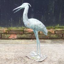 A bronzed garden model of a heron, 62cm high