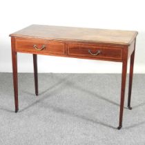An Edwardian mahogany side table, containing two drawers 102w x 46d x 75h cm