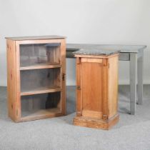 An antique pine bedside cupboard with a marble top, together with a painted side table and a