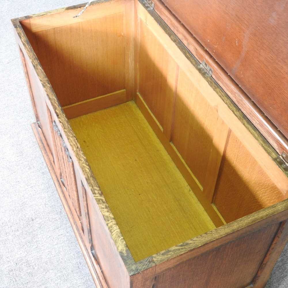 A 1920' s oak blanket box, with a hinged lid and linenfold front 90w x 44d x 54h cm - Image 2 of 6