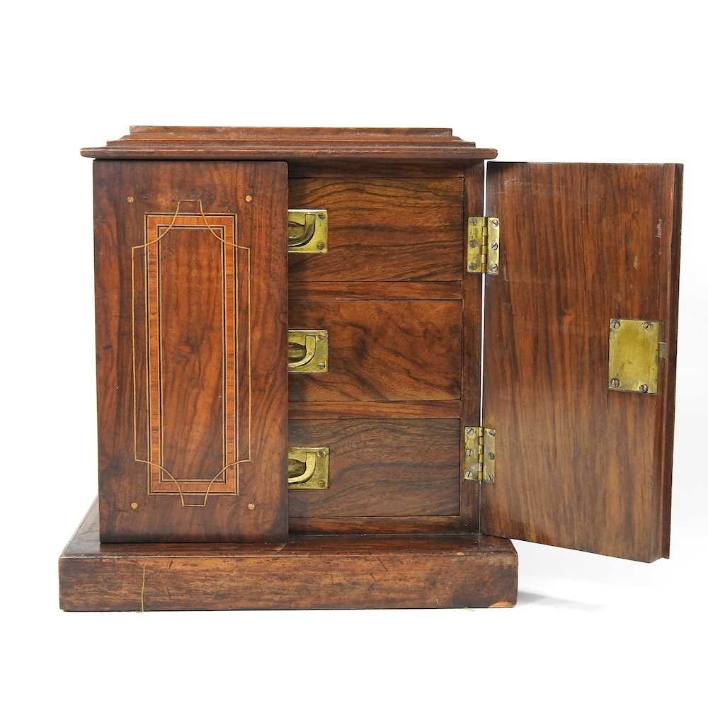 An Edwardian walnut and inlaid collector's cabinet, containing three short drawers 27w x 18d x 31h