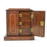 An Edwardian walnut and inlaid collector's cabinet, containing three short drawers 27w x 18d x 31h