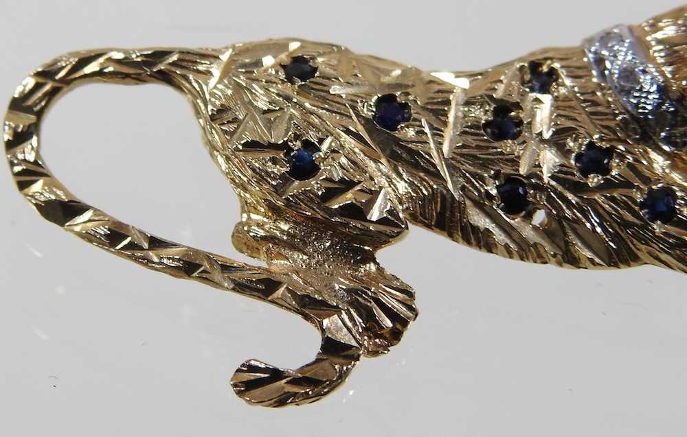 A 9 carat gold brooch, in the form of a panther, with sapphire spots, ruby eyes and a diamond - Image 3 of 7