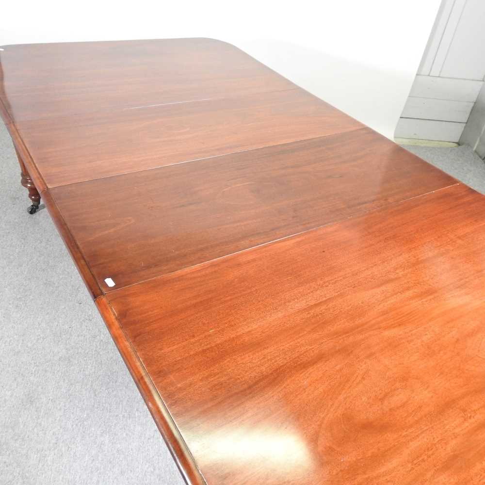 A Victorian style pull out extending dining table, 20th century, with four additional leaves, on - Image 3 of 5