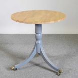 An oak and painted occasional table, on a splayed base 70d x 74h cm