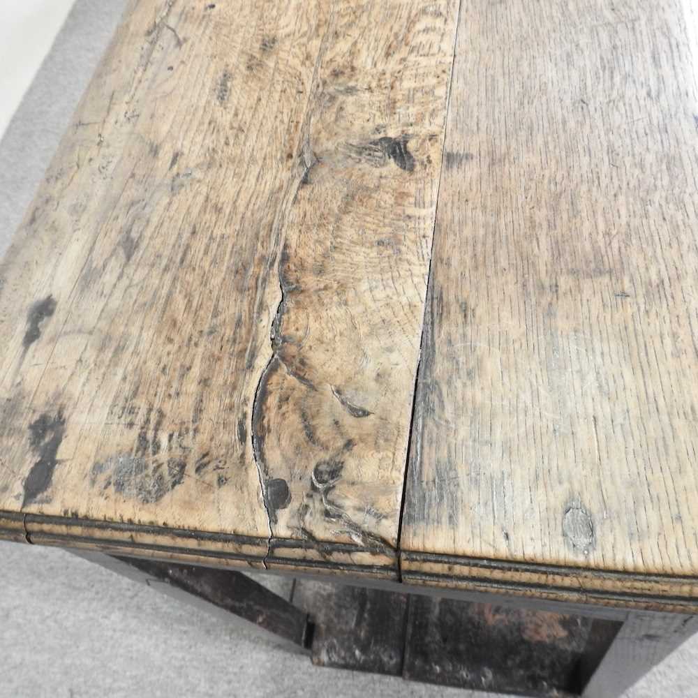 An 18th century Welsh dresser base, of narrow proportions, with an undulating frieze, on square - Image 14 of 19