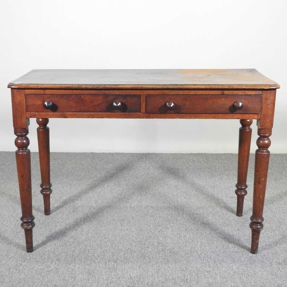 A Victorian mahogany side table, on turned legs 102w x 45d x 71h cm