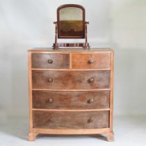A Victorian oak bow front chest of drawers, together with a Victorian toiletry mirror (2) 108w x 54d