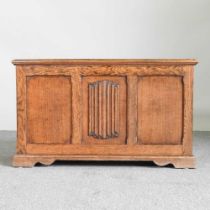 A 1920' s oak blanket box, with a hinged lid and linenfold front 90w x 44d x 54h cm