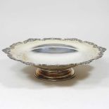 A mid 20th century silver bowl, of circular pedestal form, with a shaped rim, by Mappin & Webb,