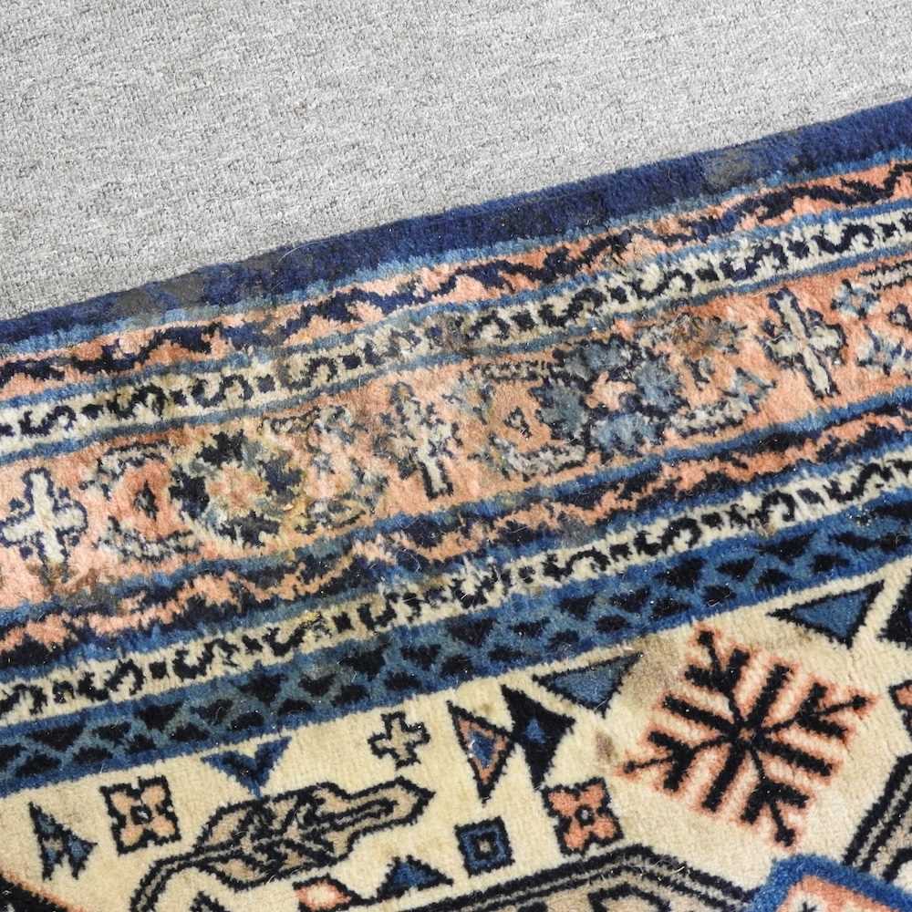A Turkish woollen rug, with a central medallion, on a blue ground, 256 x 159cm - Image 2 of 6