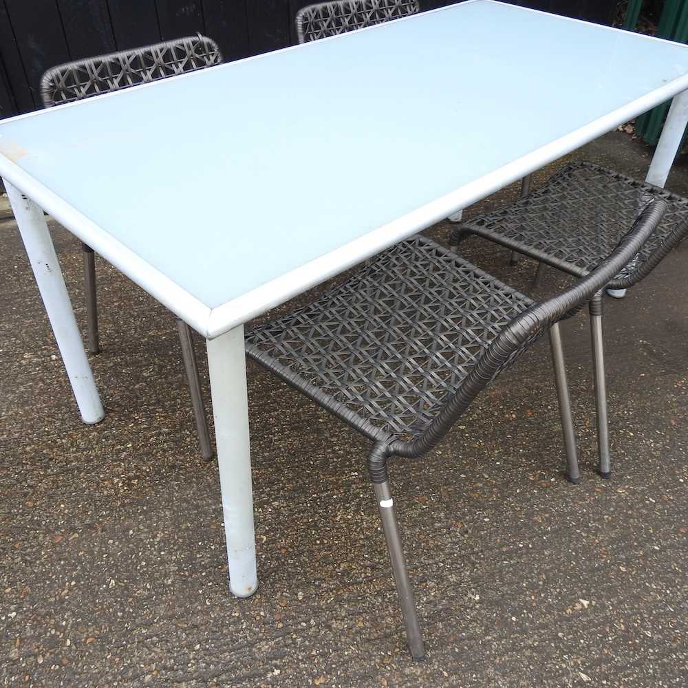 A metal glass top garden table and four woven garden chairs (5) 156w x 78d x 72h cm - Image 2 of 3