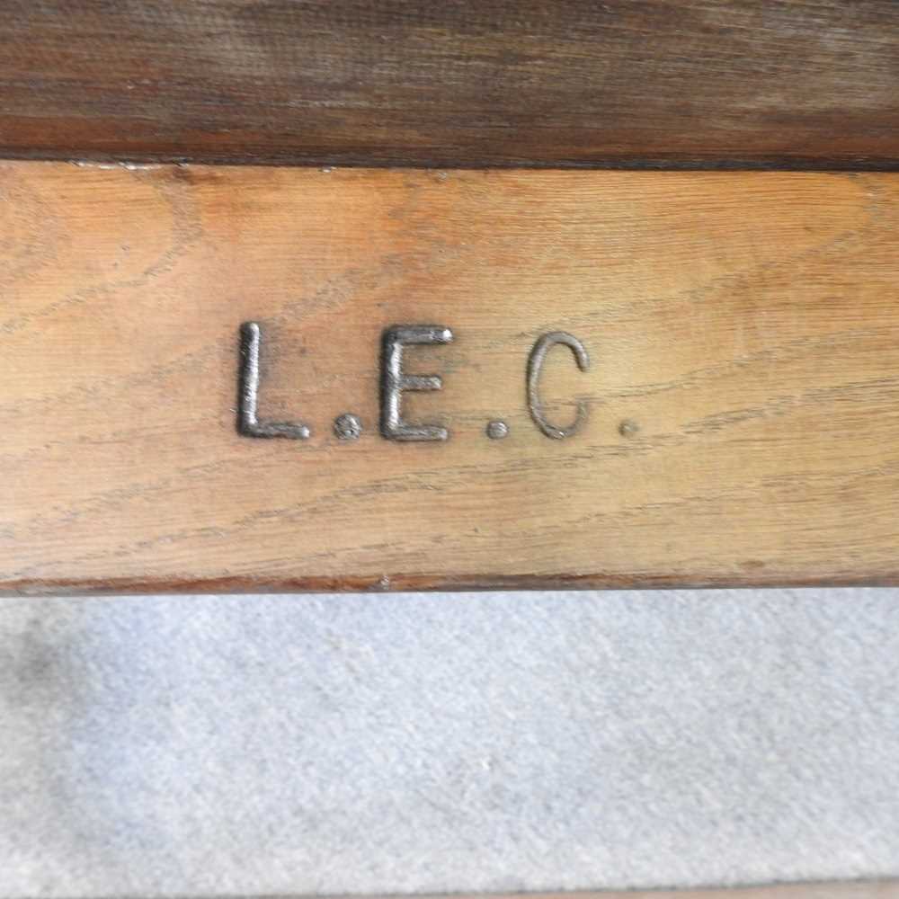 An early 20th century wooden school desk, on an iron base, stamped LEC 102w x 70d x 66h cm - Image 2 of 5