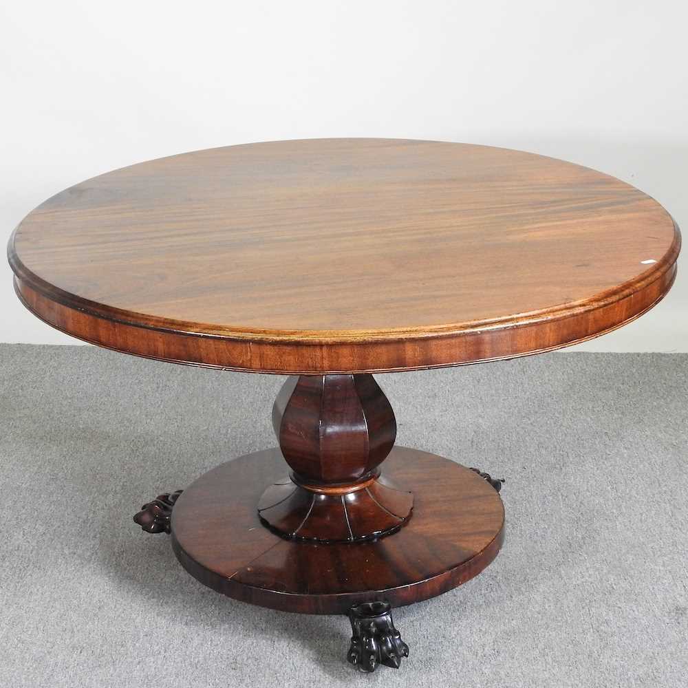 A Victorian hardwood breakfast table, with a hinged circular top, on a platform base 115w x 81h cm