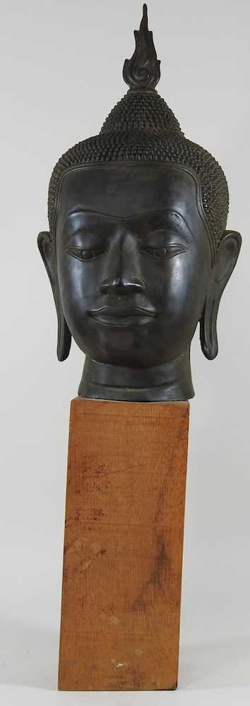 An Eastern bronze life-sized Buddha head, probably 20th century, mounted on a wooden base, 73cm high - Image 9 of 11