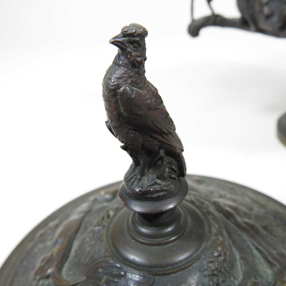 A 19th century cast bronze cup and cover, of pedestal form, decorated in relief with game, flanked - Image 4 of 12