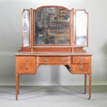 An Edwardian mahogany dressing table, on square legs 138w x 60d x 170h cm
