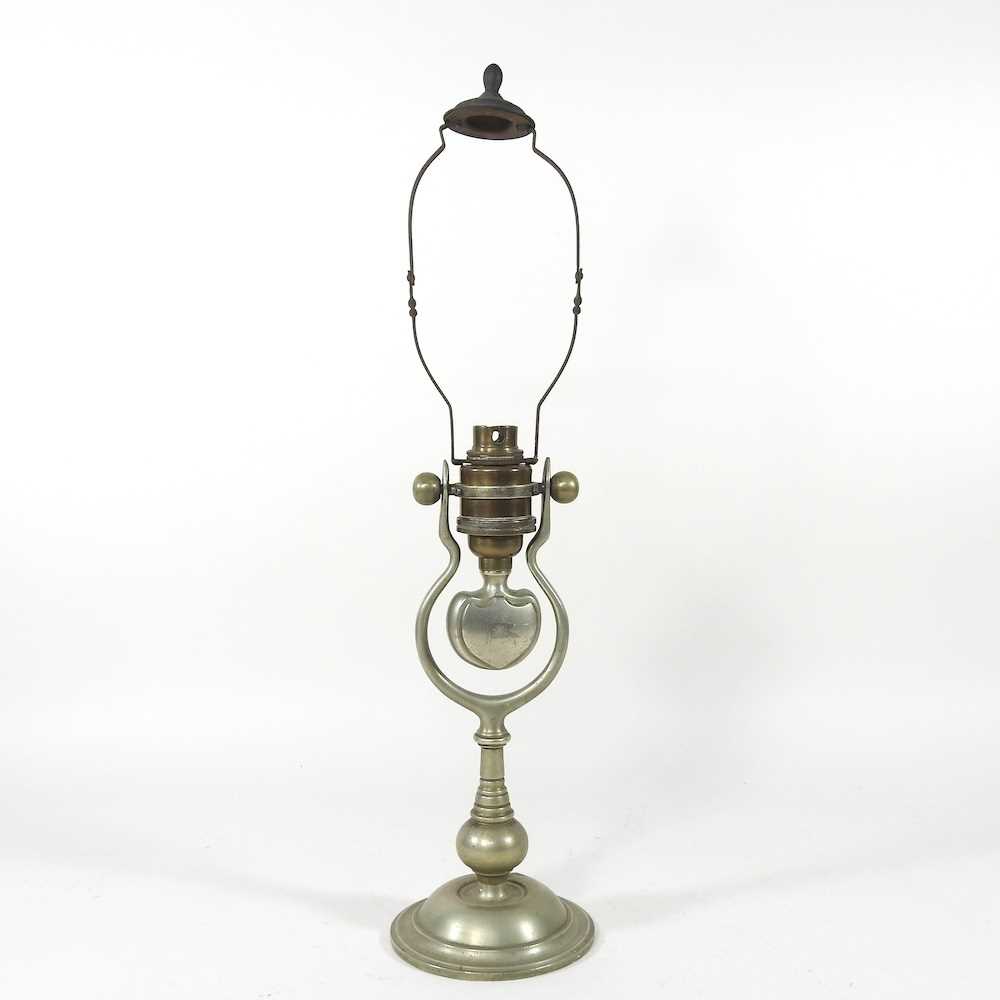 An early 20th century brass ship's oil lamp, with engraved White Star Line flag, on a gimbal