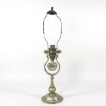 An early 20th century brass ship's oil lamp, with engraved White Star Line flag, on a gimbal