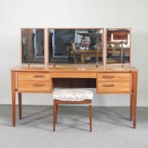 A mid 20th century teak dressing table, by Alfred Cox, with a stool (2) 153w x 46d x 120h cm Overall