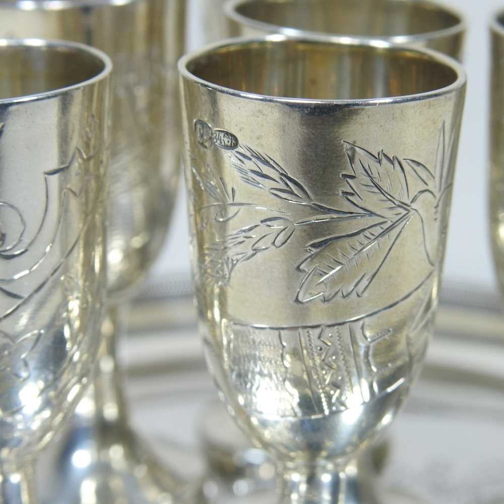 A Russian silver liqueur set, engraved with flowers, with six stem shot cups, 7cm high, on a - Image 5 of 6