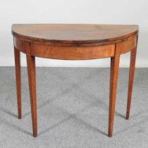 A George III mahogany D shaped folding tea table, on tapered legs 90w x 44d x 74h cm