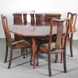 An Edwardian sideboard, together with a dining table and set of four early 20th century dining