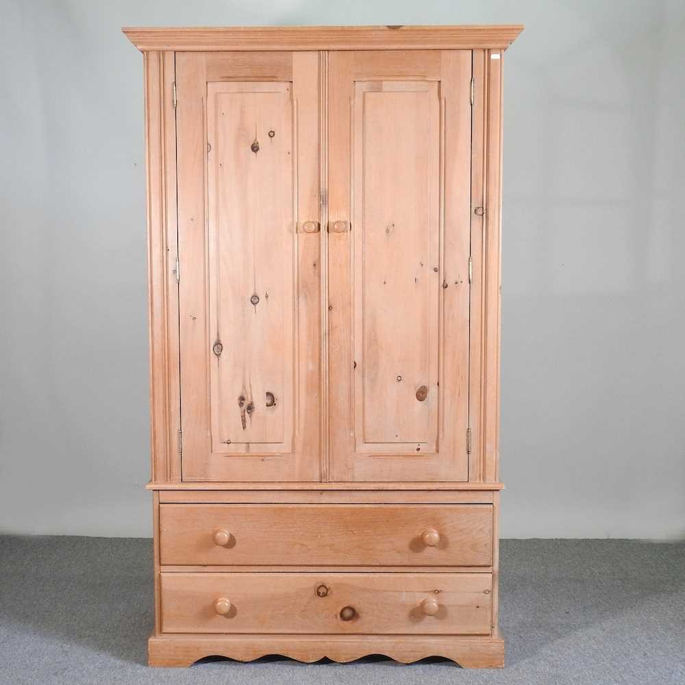 A modern pine double wardrobe, with drawers below 114w x 60d x 189h cm